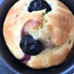 cooked blueberry lemon protein muffins in a muffin tin