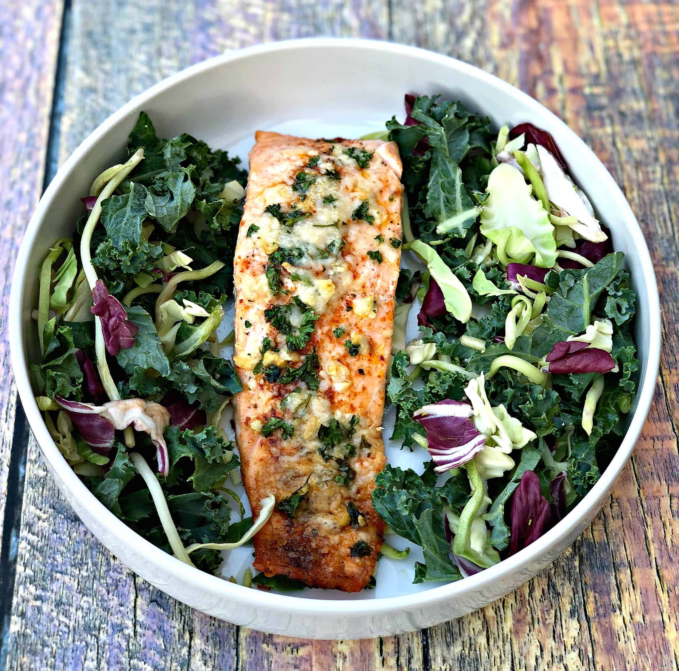 parmesan crusted salmon with herbs with salad