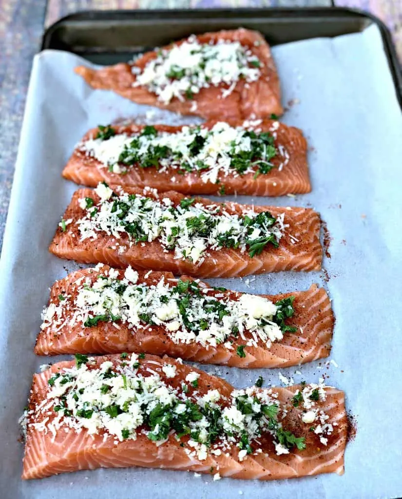 raw salmon sliced with herbs and cheese