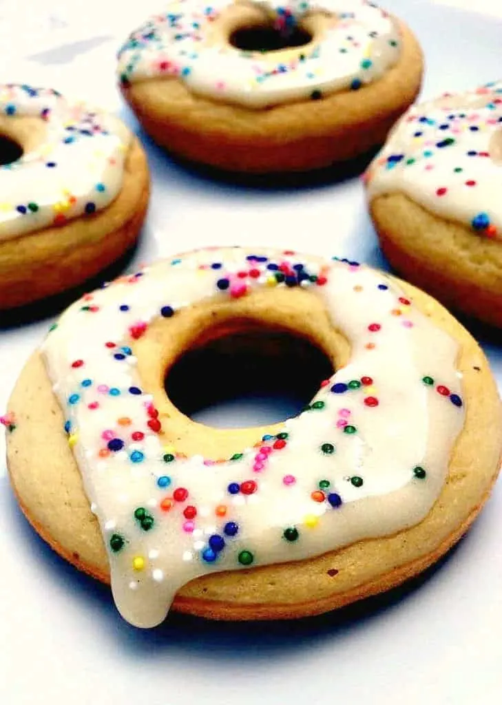protein donut with frosting and sprinkles on a white plate
