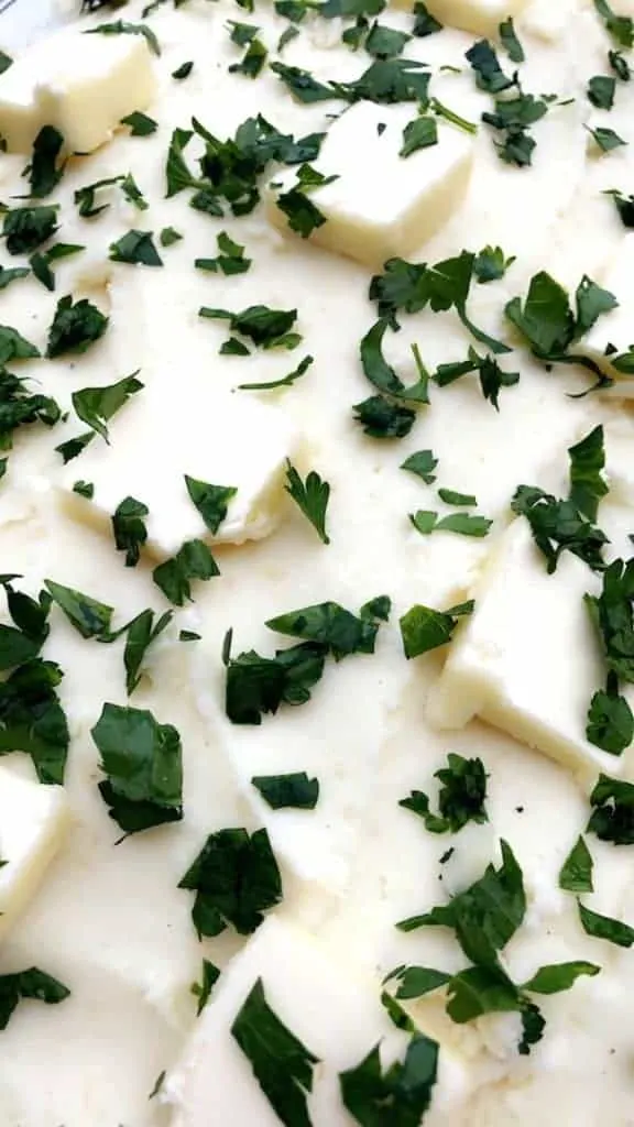 baking dish of cream cheese garlic parmesan mashed potatoes
