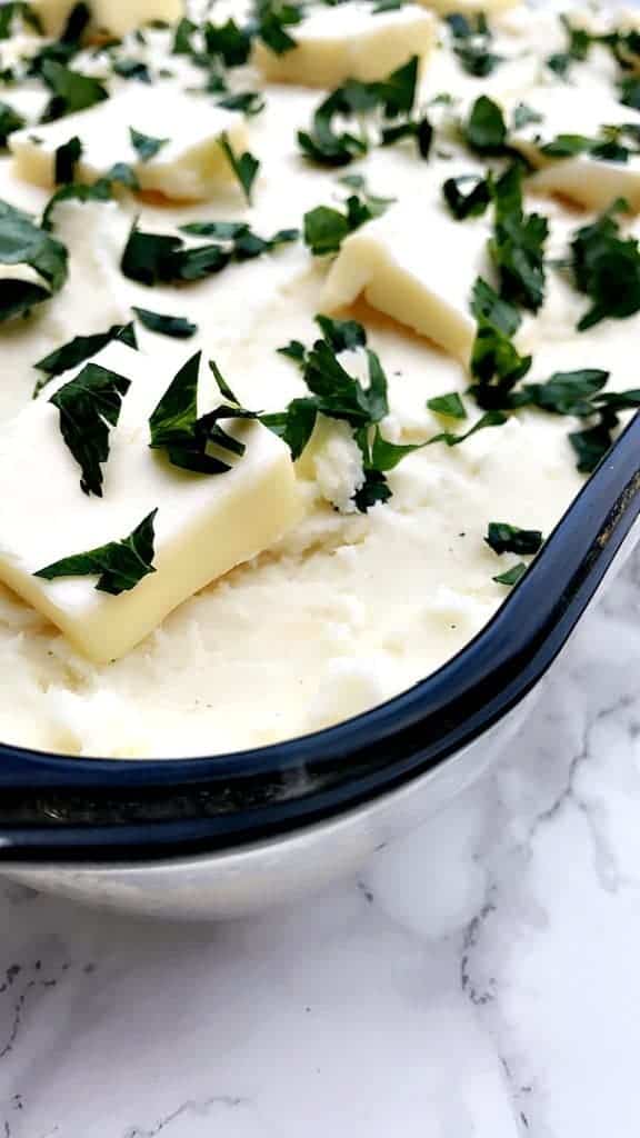 baking dish of cream cheese garlic parmesan mashed potatoes