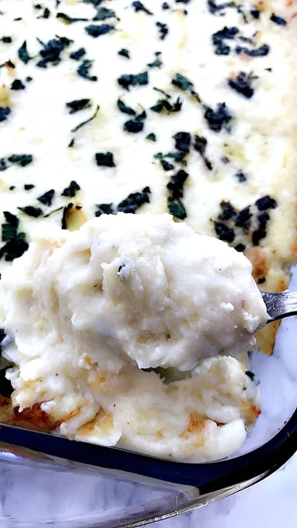 baking dish of cream cheese garlic parmesan mashed potatoes