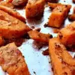 Parmesan Sweet Potatoes on a foil lined baking sheet