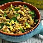Low-Carb Paleo Cauliflower Vegetable Fried Rice with Chicken in a serving dish
