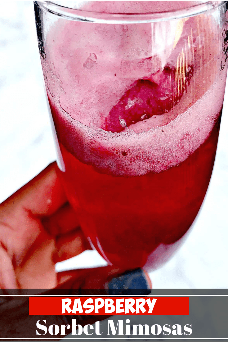 Dress up your celebrations with mimosas with a drop of frozen, raspberry sorbet and champagne perfect for holidays, events, and all occasions. #HolidayDrinks #HolidayCocktails #NewYearsDrinks #BrunchMimosas #BrunchDrinks