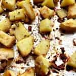 foil lined baking sheet with shopped Yukon potatoes seasoned with honey garlic