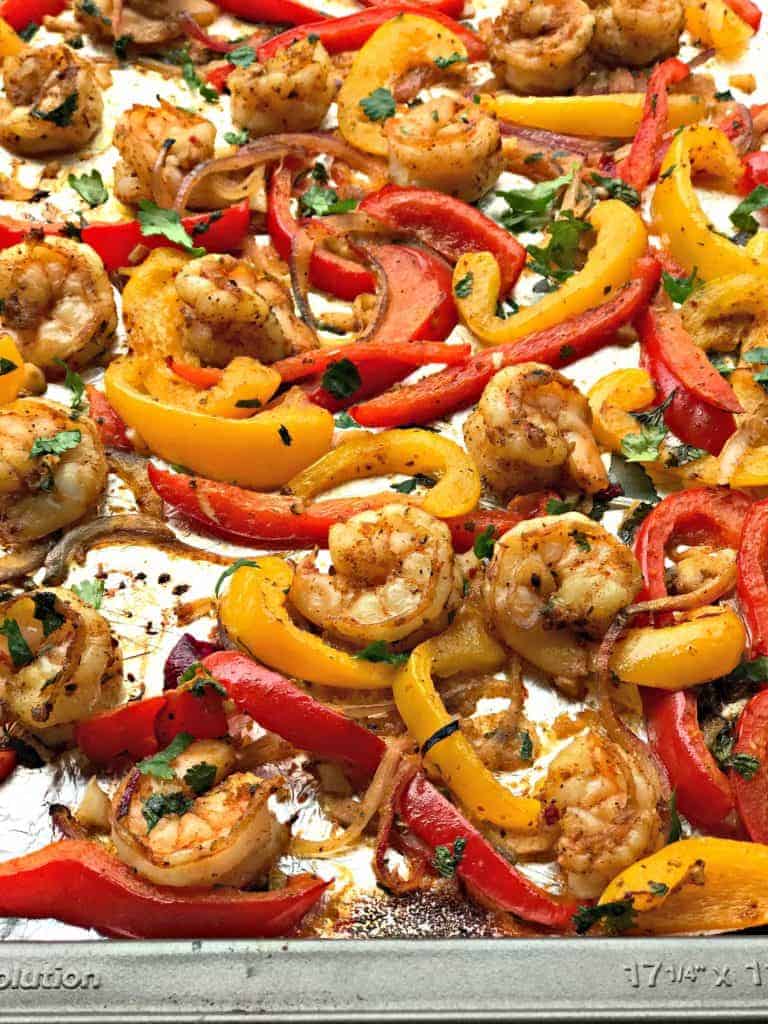 overview of shrimp fajitas on a baking sheet