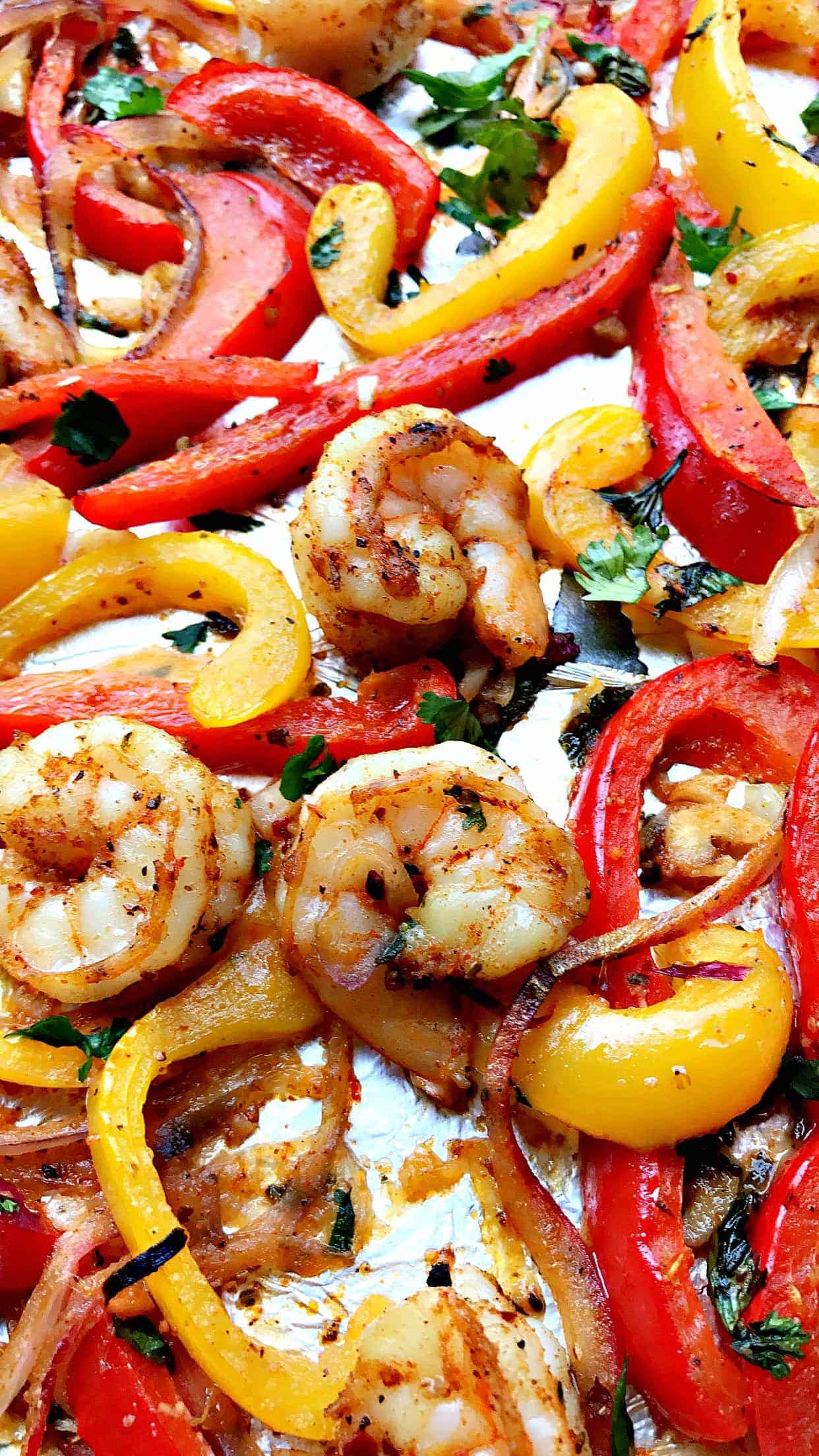 close up of shrimp fajitas on a baking sheet