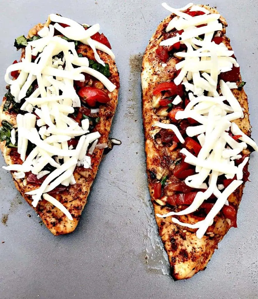 bruschetta stuffed chicken with shredded cheese