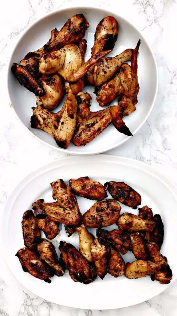 grilled bbq chicken wings in a large white bowl