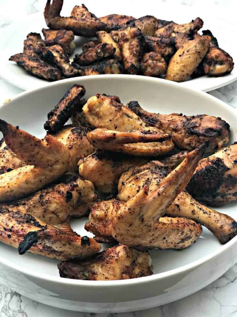 grilled bbq chicken wings in a large white bowl