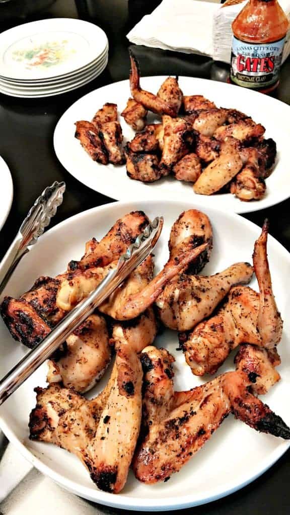 grilled bbq chicken wings in a large white bowl