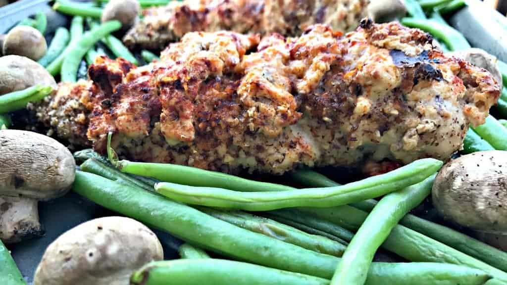 sheet pan almond crusted chicken stuffed with smoked cheddar and bacon