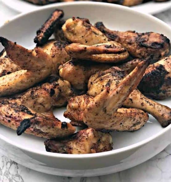 chicken-marinade header grilled bbq chicken wings in a large white bowl