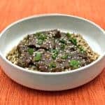 mongolian beef, quinoa and brown rice in a white bowl