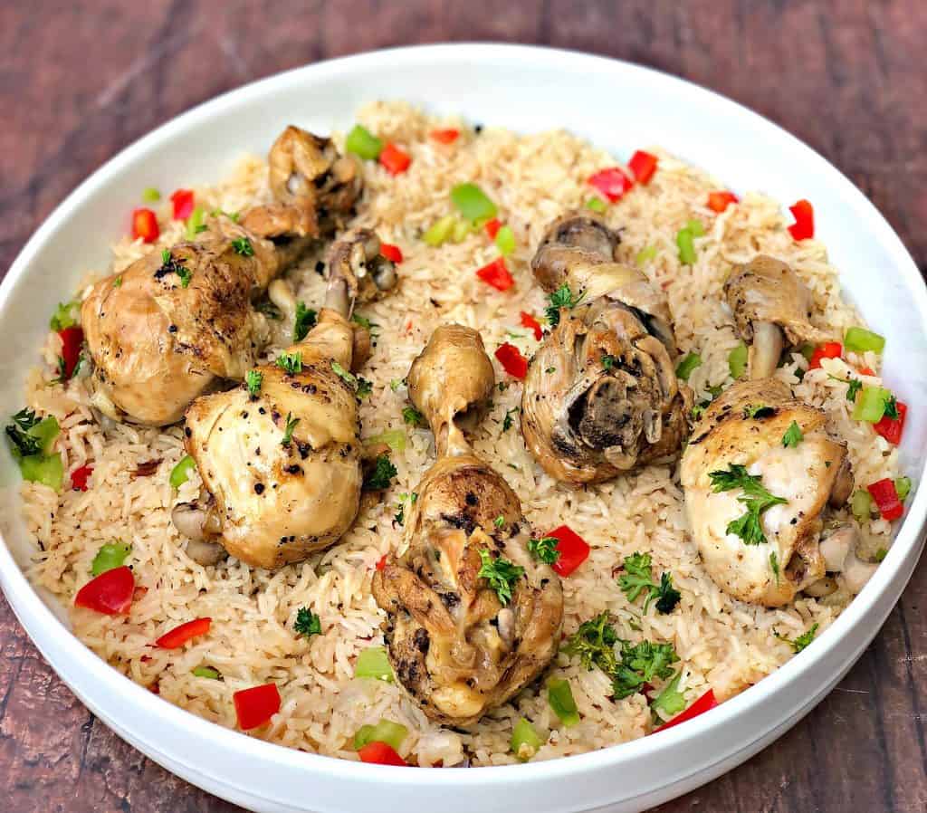 arroz con pollo chicken and rice in a white bowl