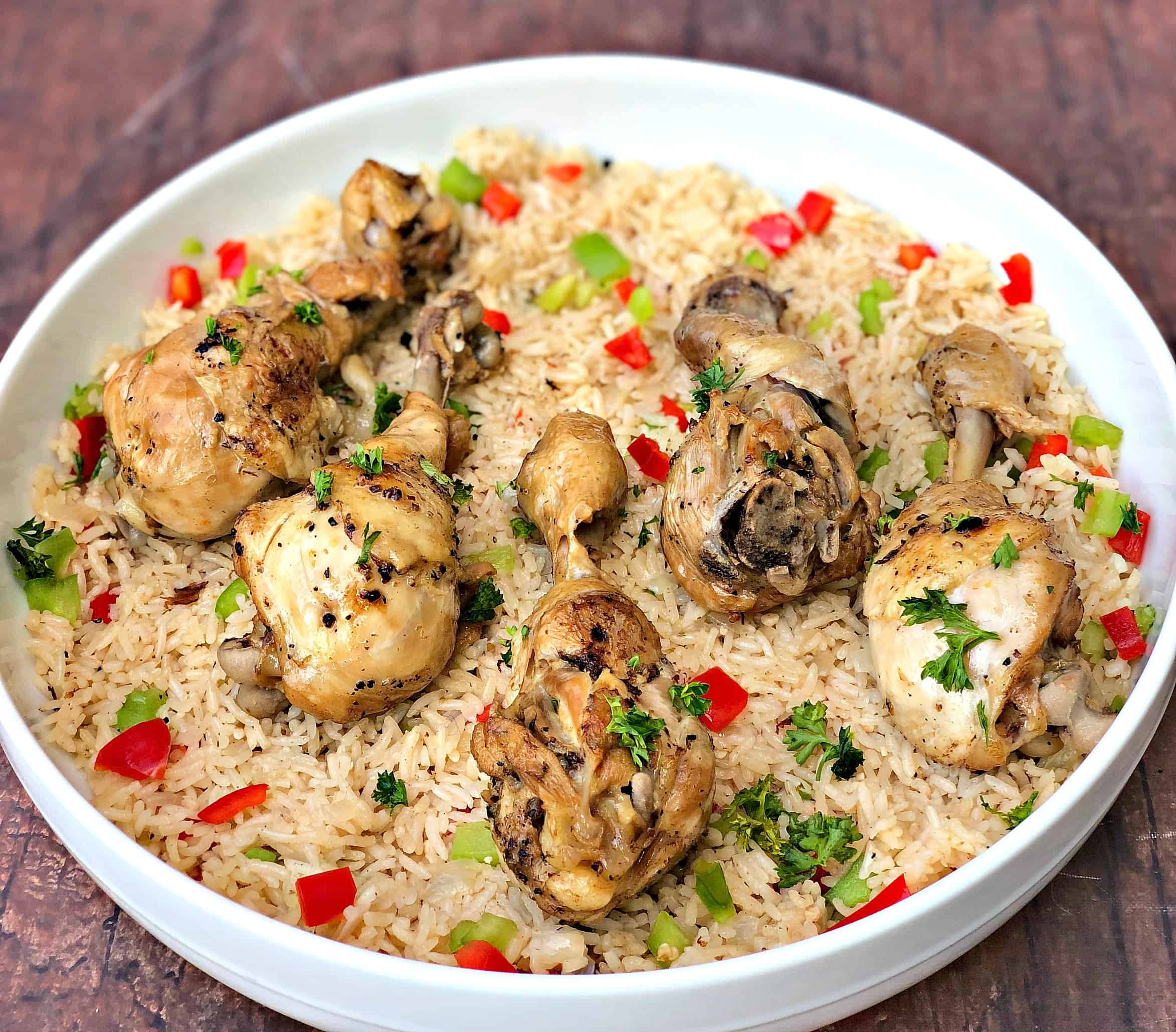 arroz con pollo chicken and rice in a white bowl