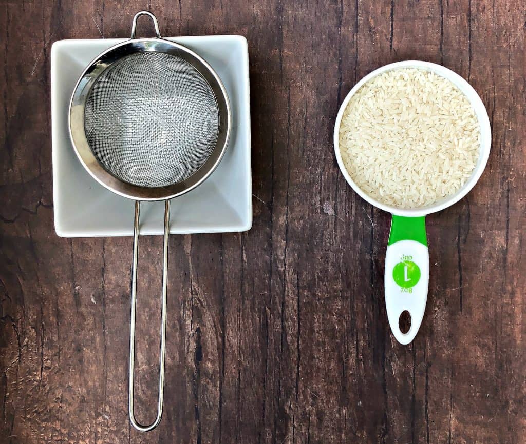 white rice and strainer