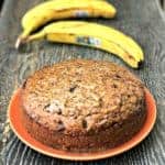 instant pot low carb banana nut bread on an orange plate next to bananas