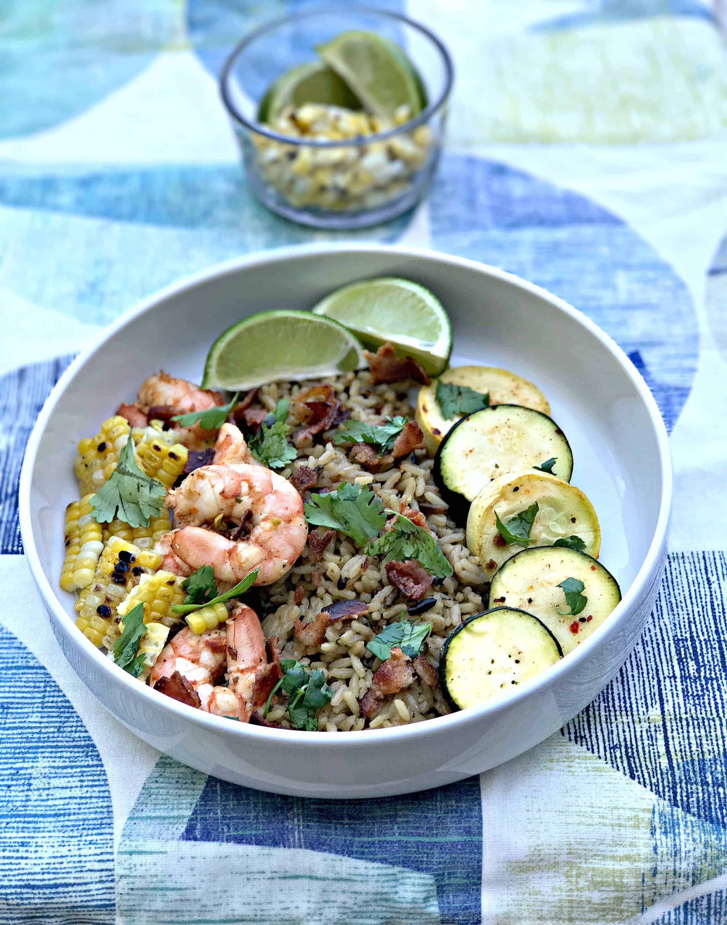 chipotle bacon bowl with grilled shrimp and veggies served in a white bowl