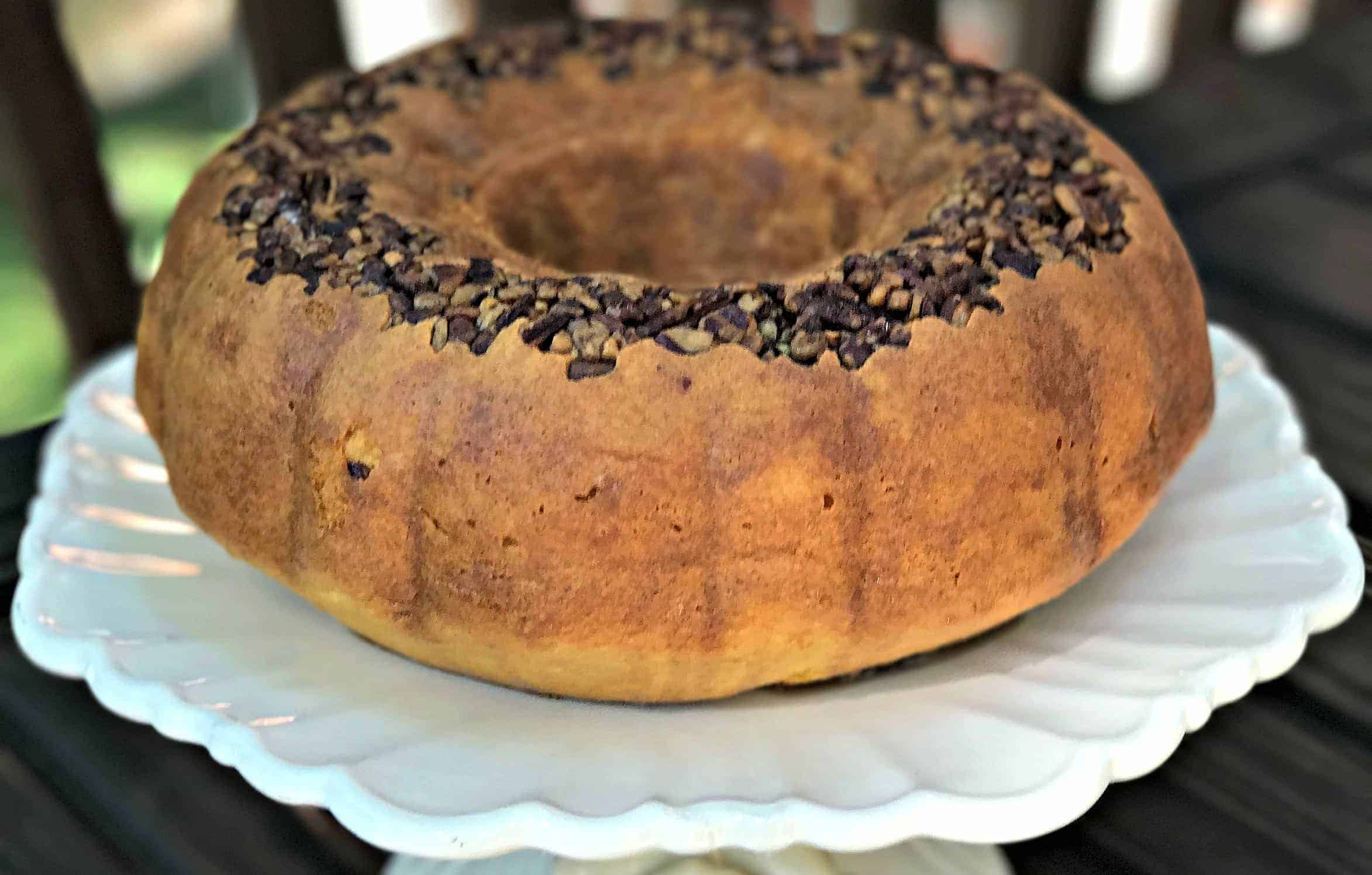 rum bundt cake on a white cake stand