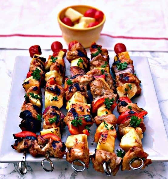 Hawaiian-Pineapple-Chicken-5-1024×1014 hawaiin pineapple chicken kabob skewers on a white plate