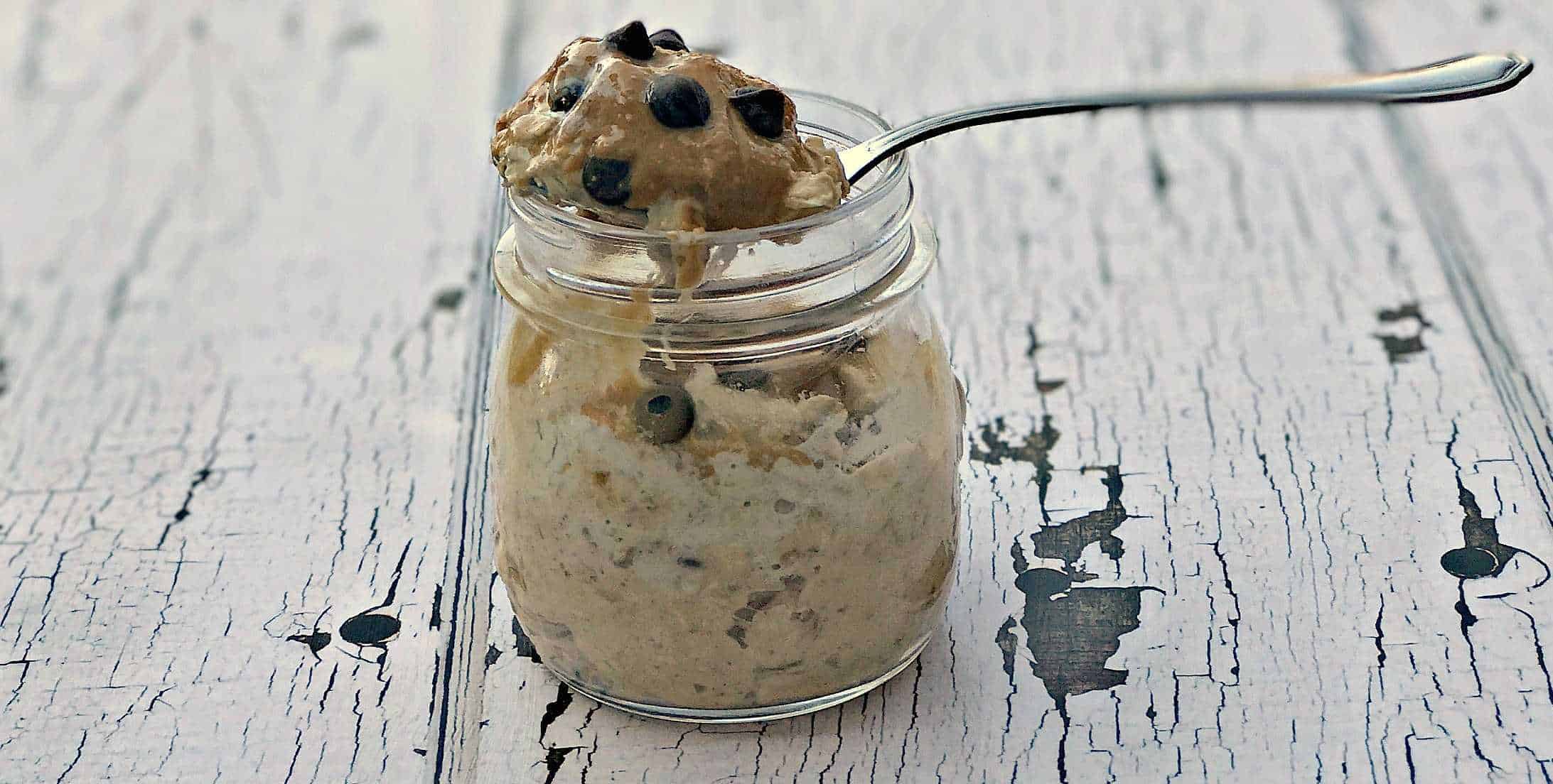 Chocolate Chip Cookie Dough Protein Overnight Oats in a glass jar