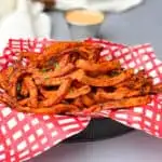 air fryer sweet potato fries served in a fry basket