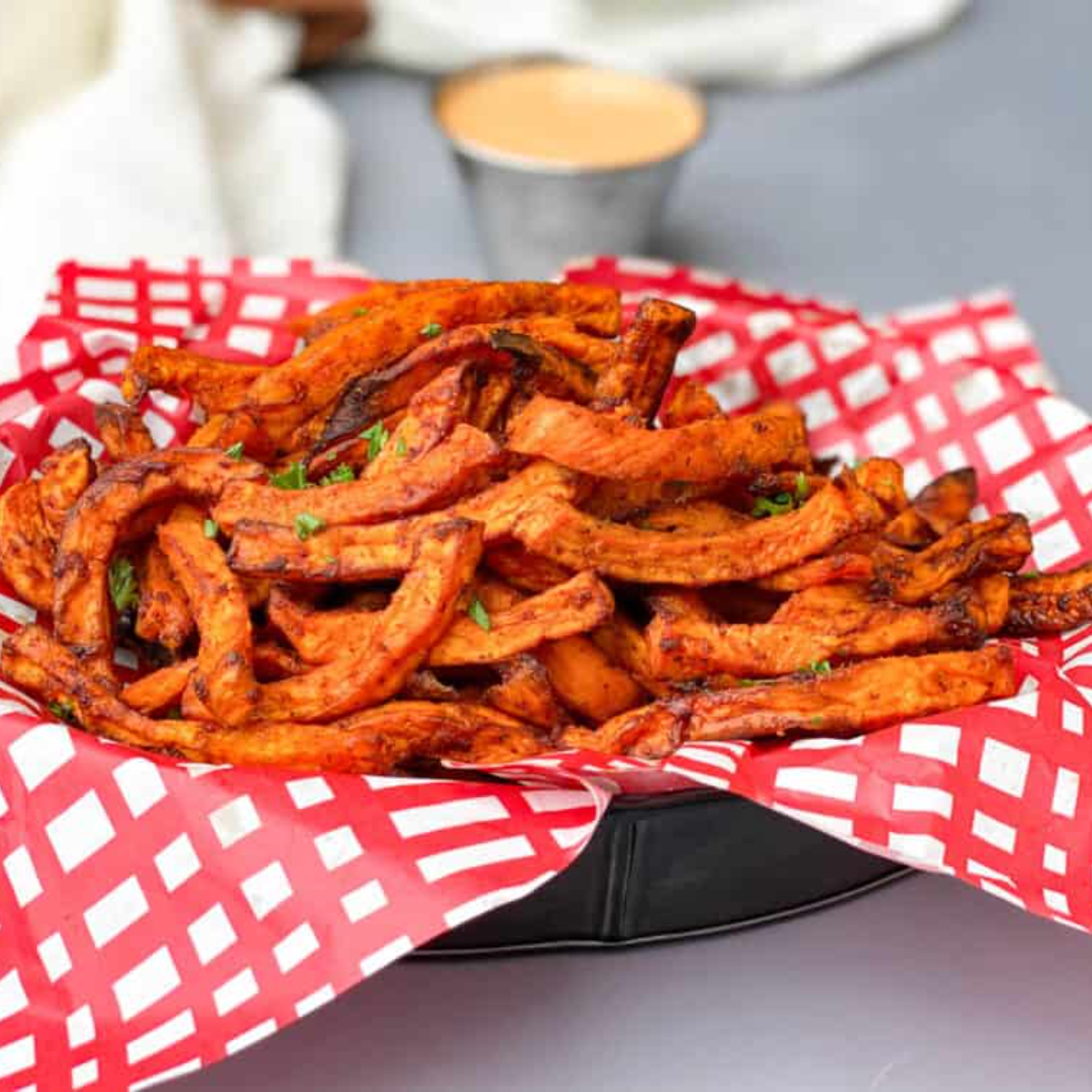 air fryer sweet potato fries served in a fry basket