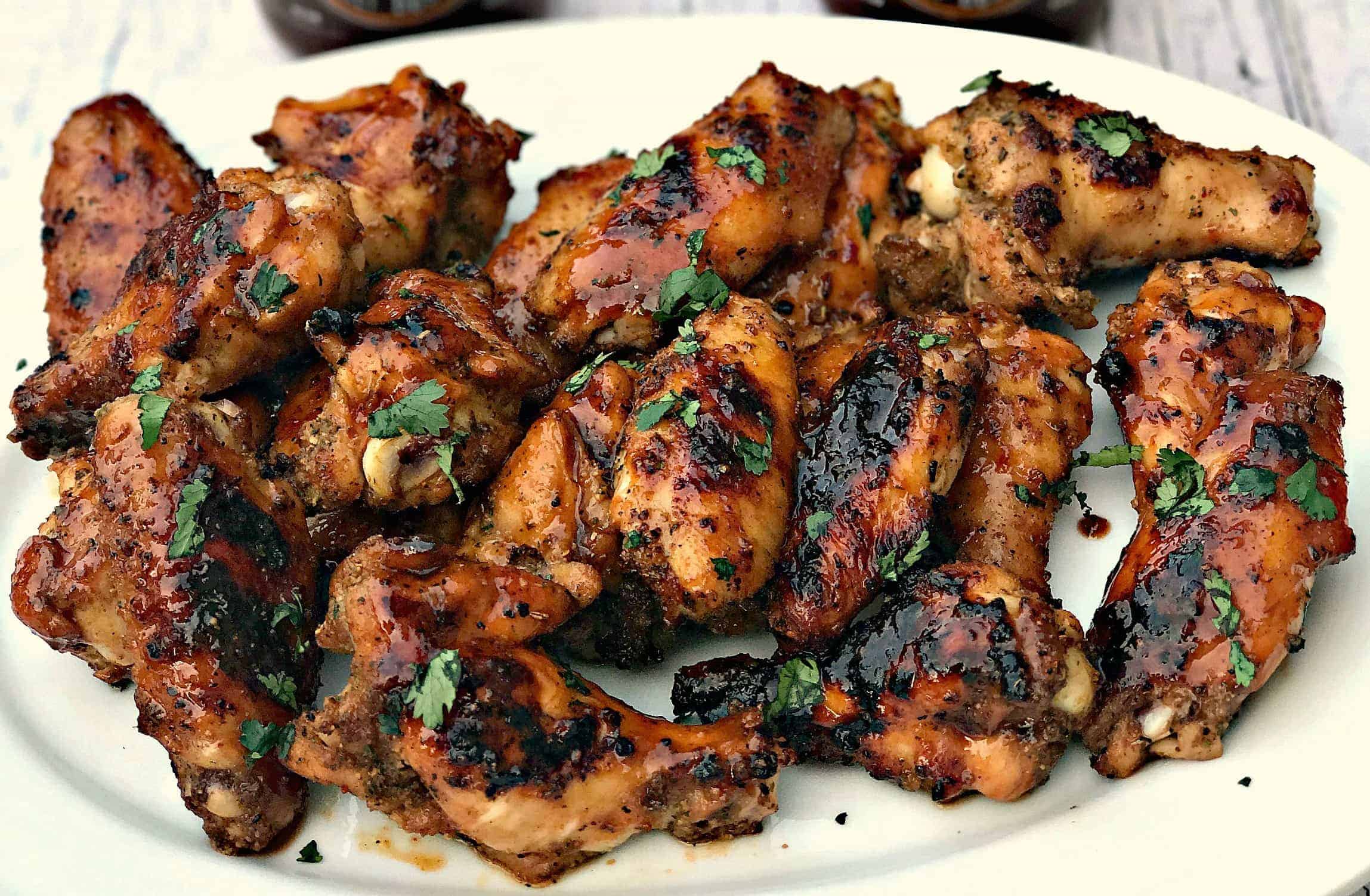 bbq ranch grilled chicken wings on a white platter