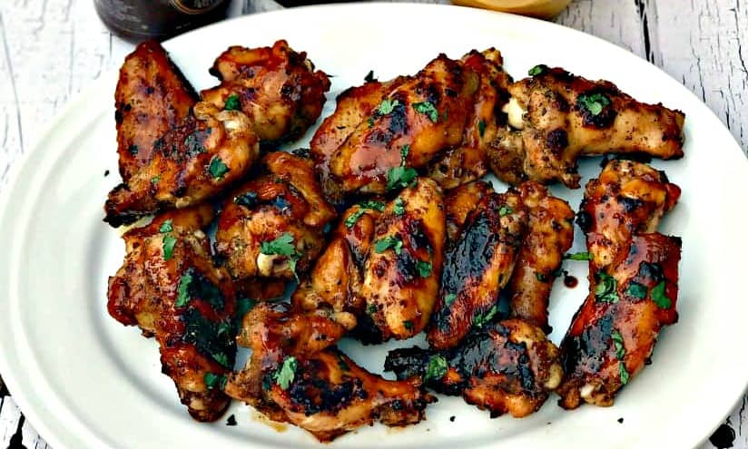bbq ranch grilled chicken wings on a white plate