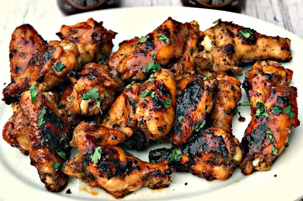 bbq ranch grilled chicken wings on a white plate