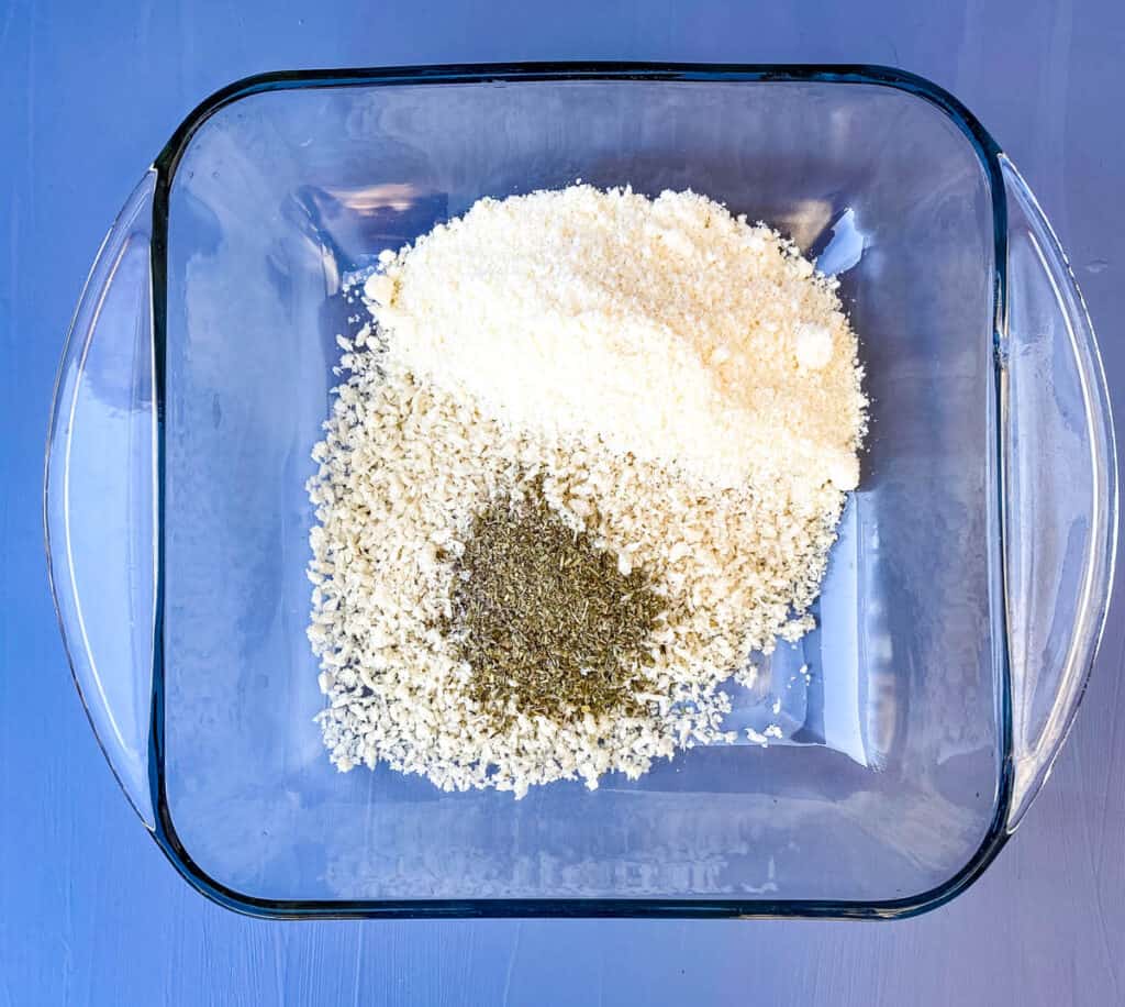 breadcrumbs, parmesan cheese, and Italian seasoning in a large glass bowl