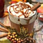 Skinny Copy-Cat Starbucks Caramel Apple Cider in a glass mug with fall decor surrounding the mug