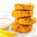 air fryer crab cakes on a white plate with fresh lemon