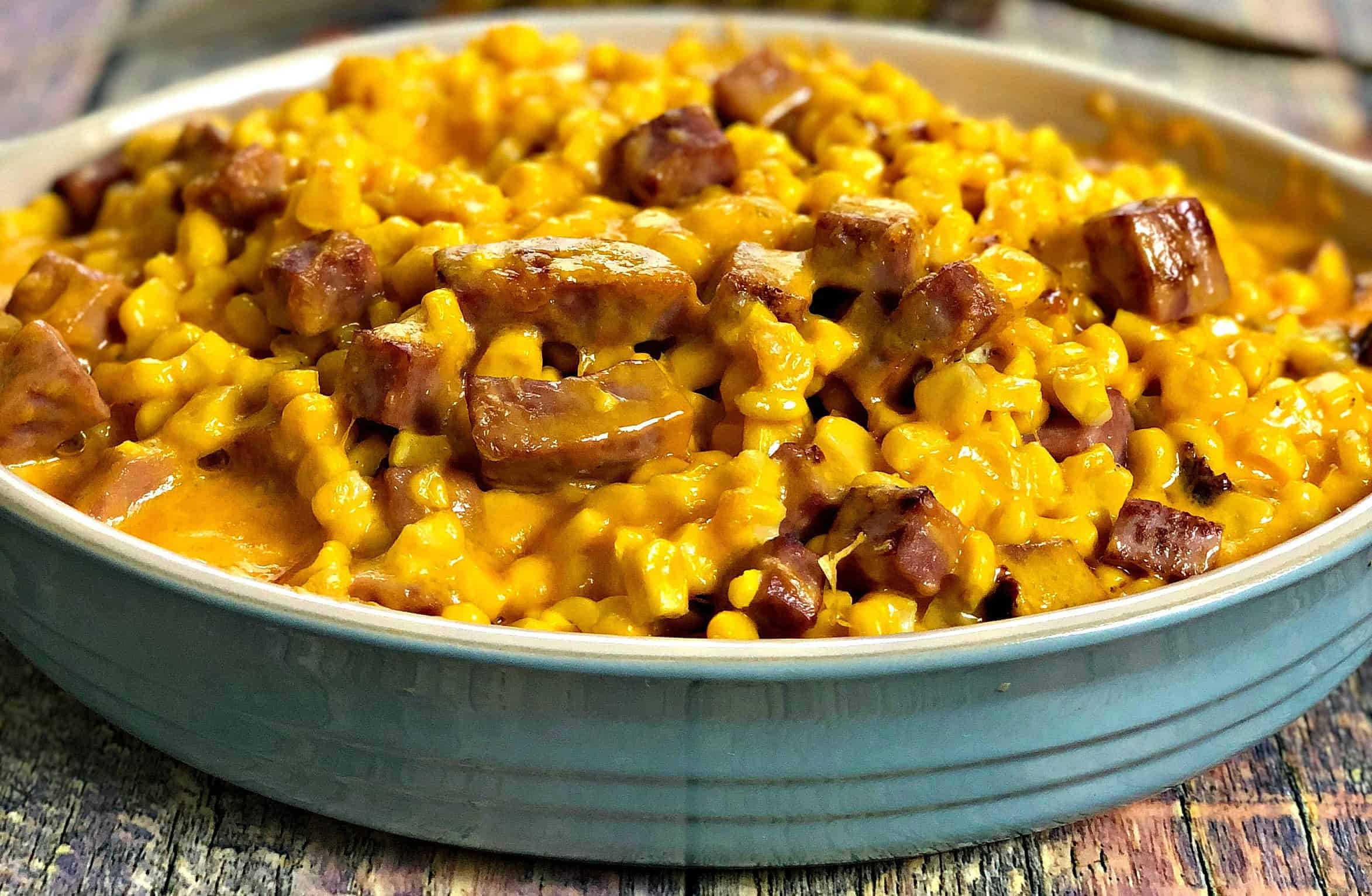 Instant Pot Baked Cheesy Corn with Ham served in a dish