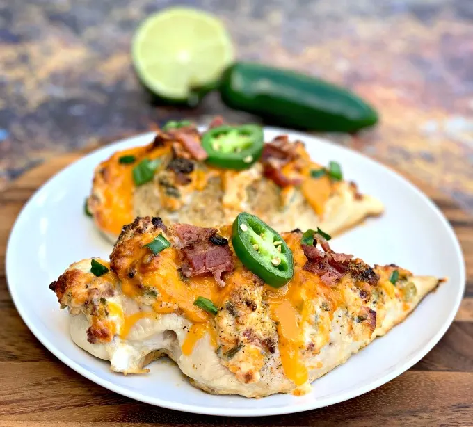 keto low carb jalapeno popper hasselback chicken on a white plate