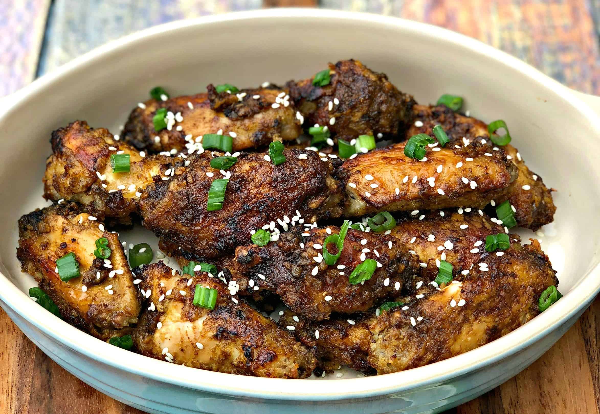 air fryer thai chili fried chicken wings in a serving dish