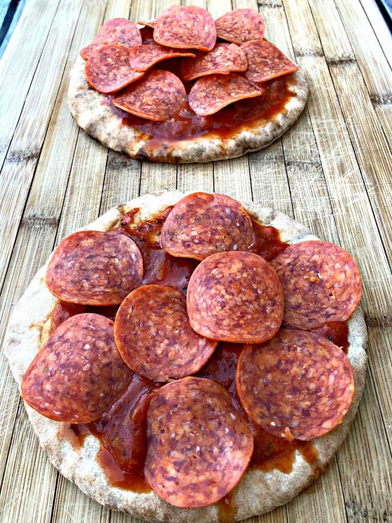 pita bread with pizza sauce, pepperoni