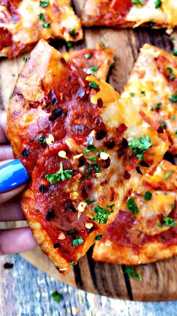 close up photo of air fryer pepperoni pizza with mozzarella cheese and crushed red pepper