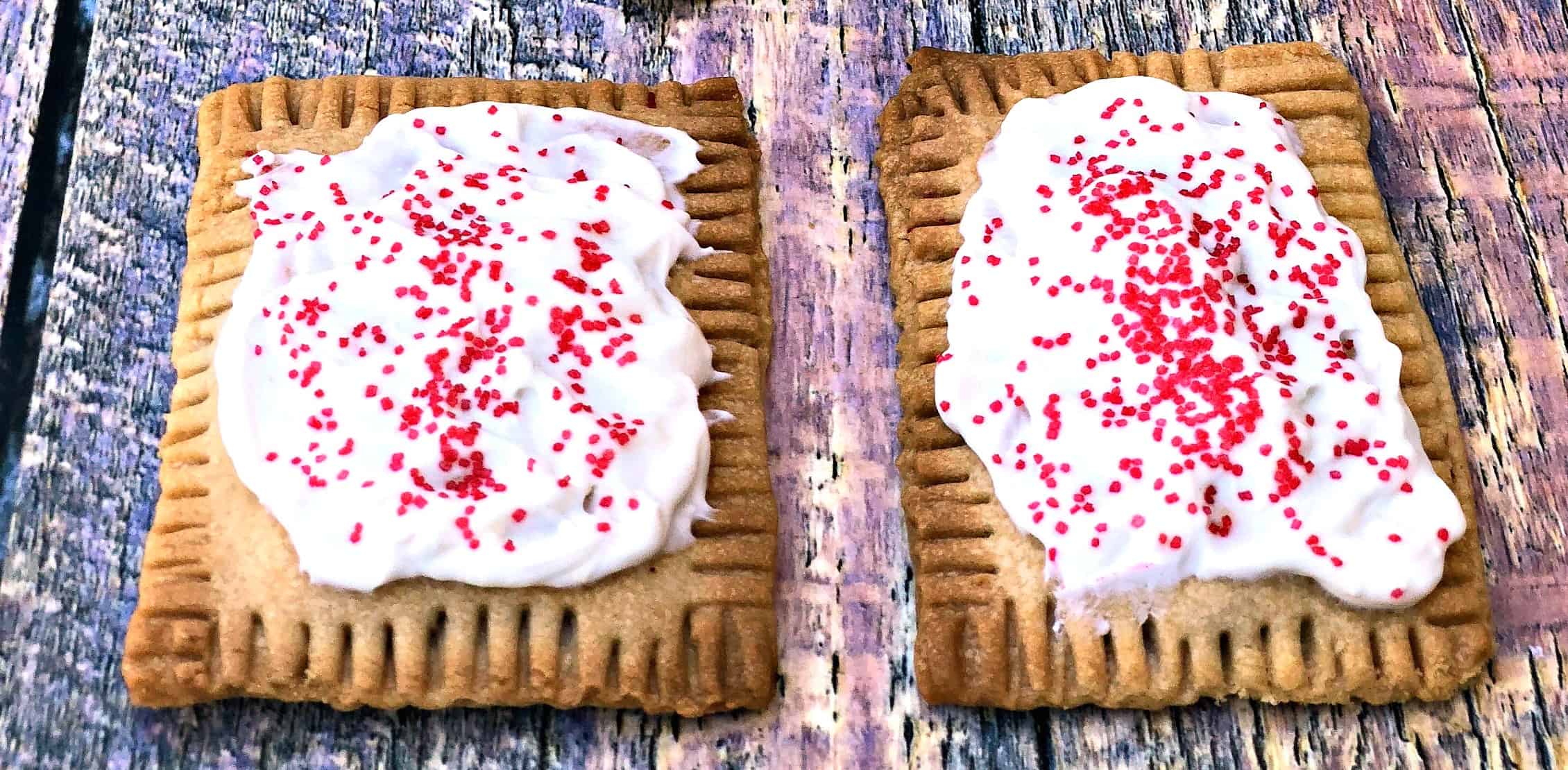 air fryer strawberry pop tarts on a multi color surface