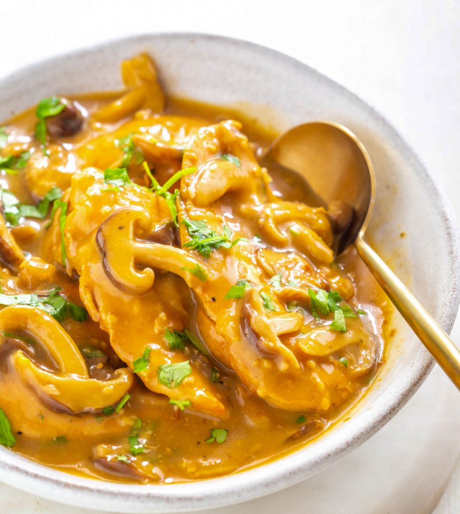 instant pot chicken marsala in a serving dish on a multi color surface