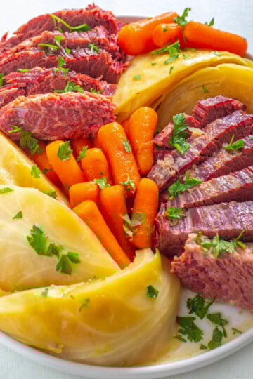 Instant Pot corned beef and cabbage on a white plate