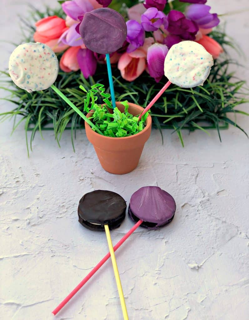 Easy 3 Ingredient Oreo Dessert Pops in a pail with Easter grass