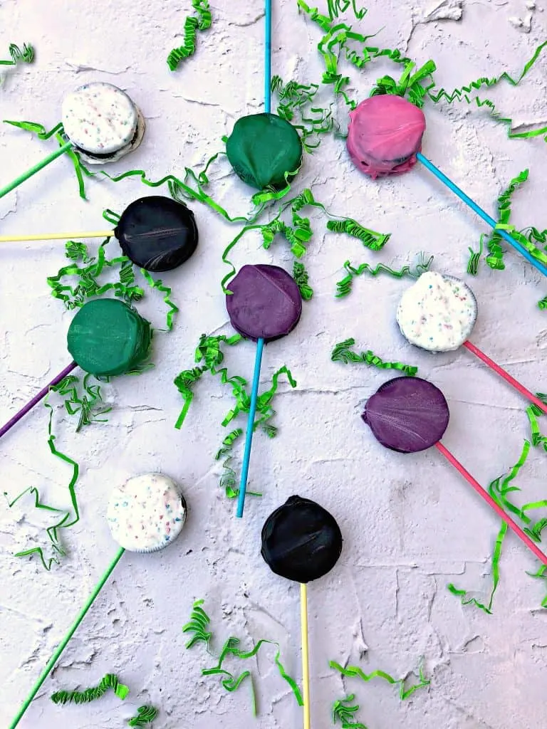 Easy 3 Ingredient Easter Oreo Candy Dessert Pops in a pail with Easter grass