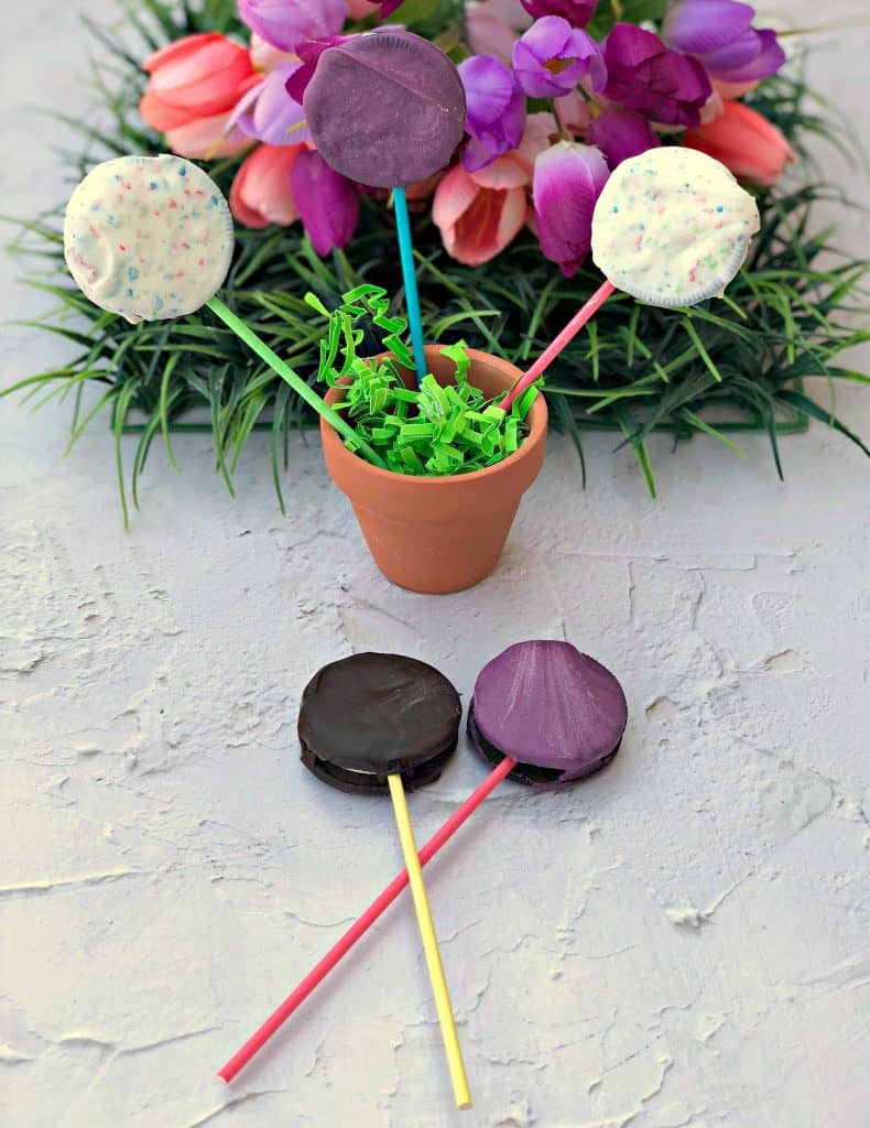 Easy 3 Ingredient Oreo Dessert Pops in a pail with Easter grass