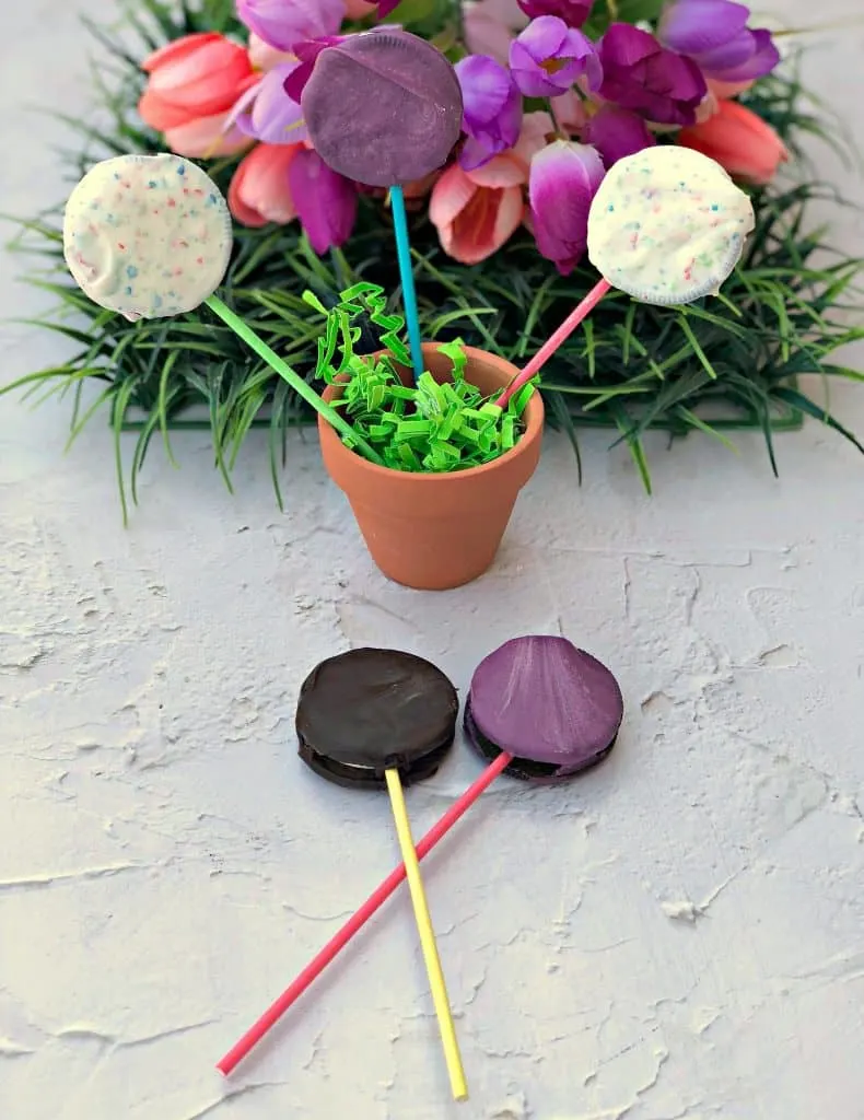 Easy 3 Ingredient Oreo Dessert Pops in a pail with Easter grass