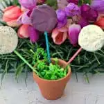 3 oreo easter dessert pops in a small planter with green easter grass