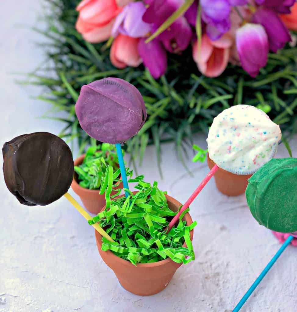 Easy 3 Ingredient Oreo Dessert Pops in a pail with Easter grass